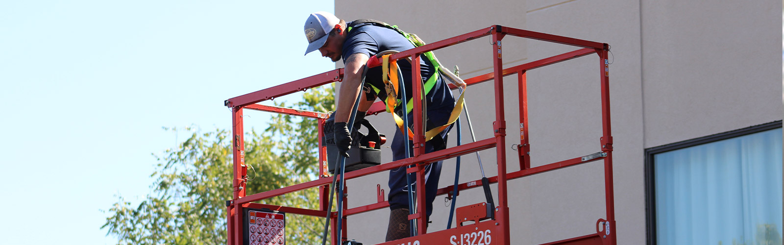 St. Louis, MO, commercial roof cleaning and power washing services removing debris and buildup from a flat commercial roof