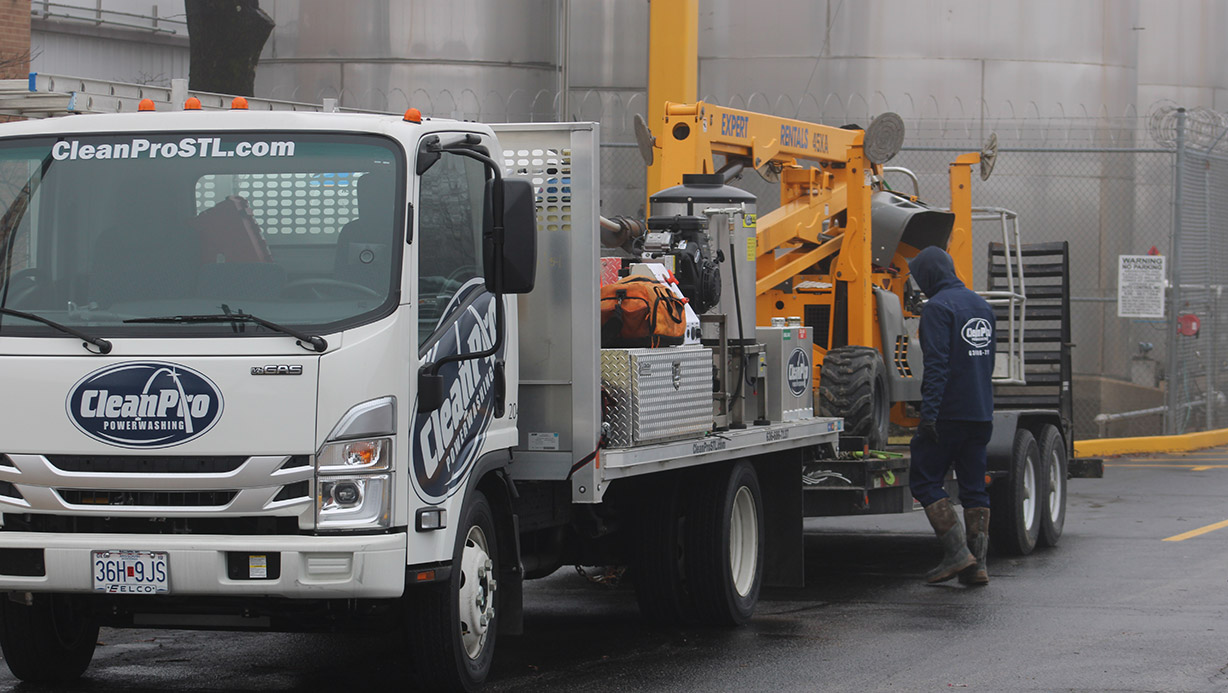 Commercial roof power washing and cleaning services on a flat commercial roof in St. Louis, MO